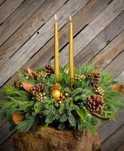 28 Christmas Centerpieces to Welcome House Guests Golden Magnolia Taper Candles #Gifts #Centerpiece #ChristmasCenterpiece #Christmas #Decor #ChristmasEvergreens