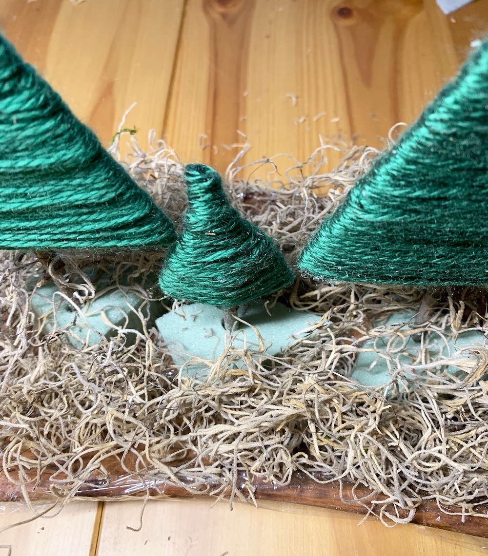 Create a Rustic Christmas Centerpiece Cover Base with Moss #DIY #DIYChristmasCenterpiece #ChristmasDecor #ChristmasTableTop #DIYChristmasProject #RusticDecor #ChristmasCenterpiece